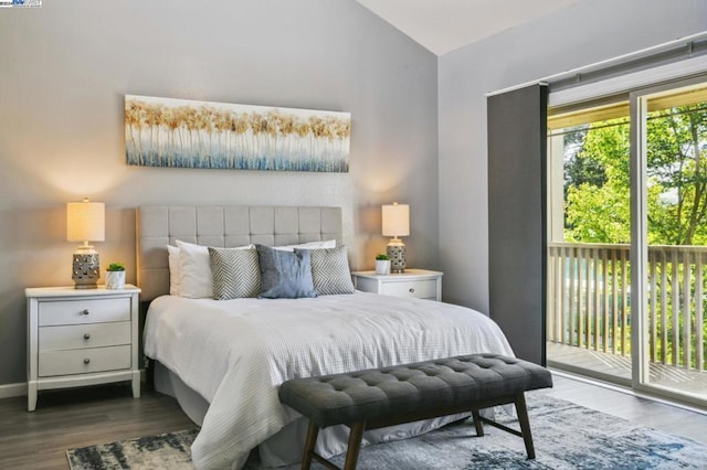 bedroom with access to exterior, dark hardwood / wood-style flooring, and vaulted ceiling