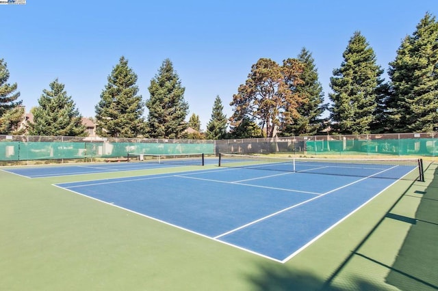 view of tennis court featuring basketball court