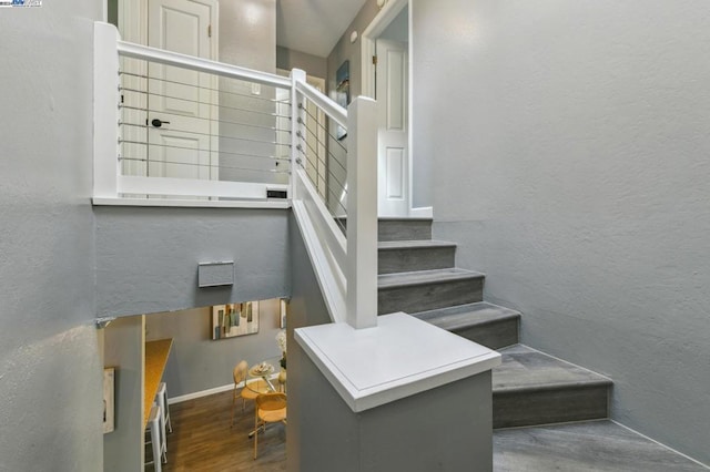 stairway featuring hardwood / wood-style floors