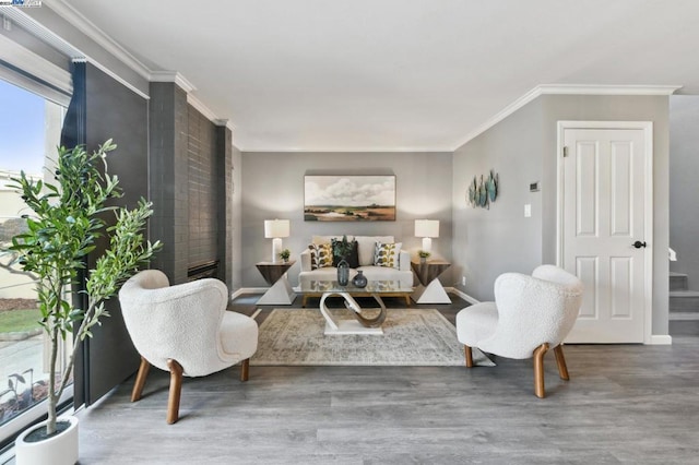 living room with hardwood / wood-style flooring and ornamental molding