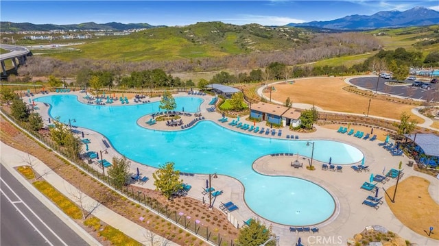 birds eye view of property with a mountain view