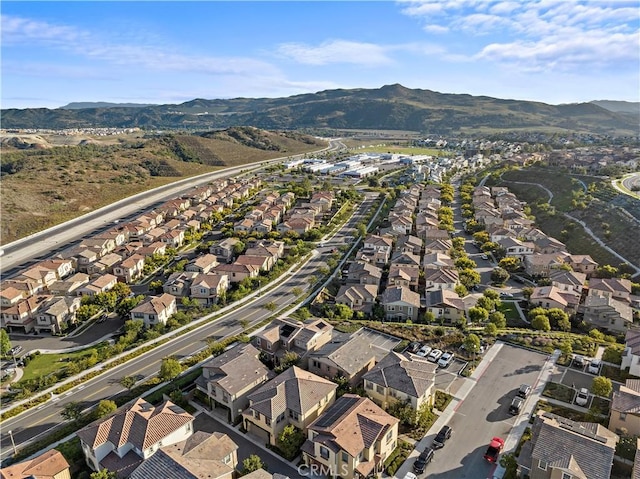 birds eye view of property featuring a mountain view