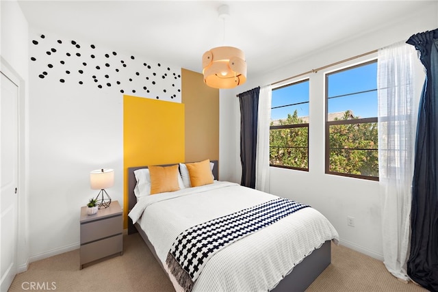 carpeted bedroom featuring a closet