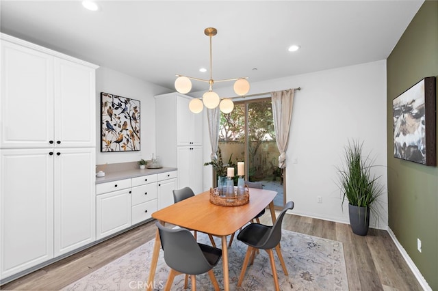 dining area with light hardwood / wood-style floors