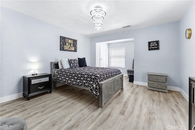 bedroom with light hardwood / wood-style flooring