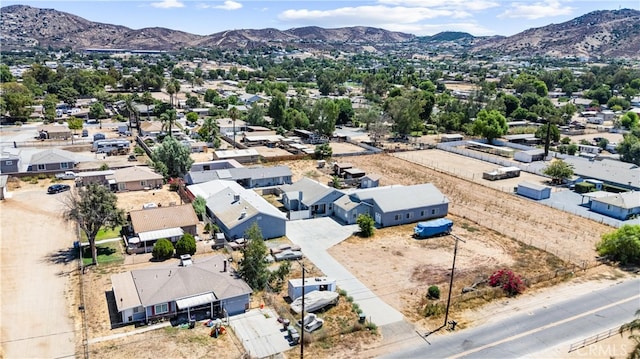 birds eye view of property featuring a mountain view