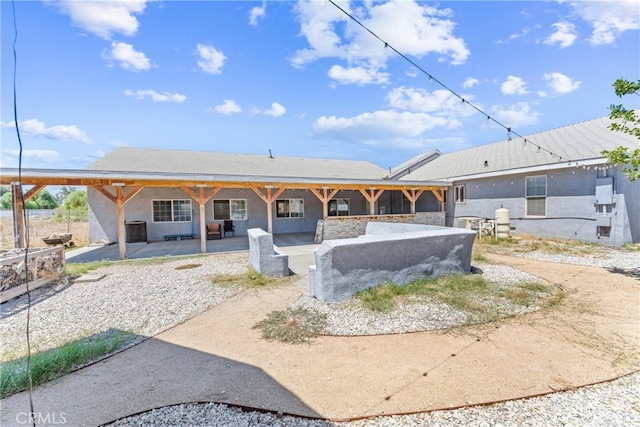 back of house featuring a patio