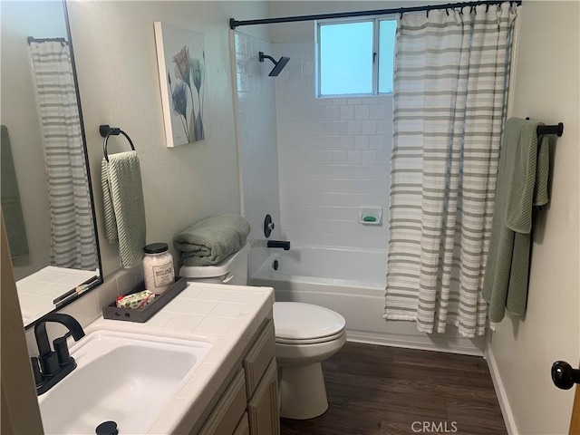 full bathroom with vanity, hardwood / wood-style flooring, toilet, and shower / bath combo with shower curtain