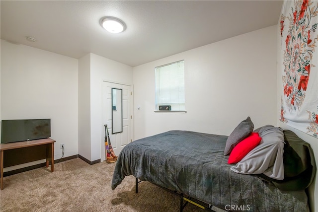 bedroom with light colored carpet