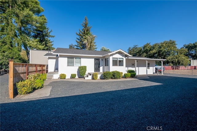 ranch-style house with a carport