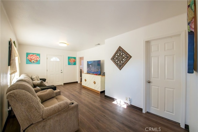 living room with dark hardwood / wood-style flooring