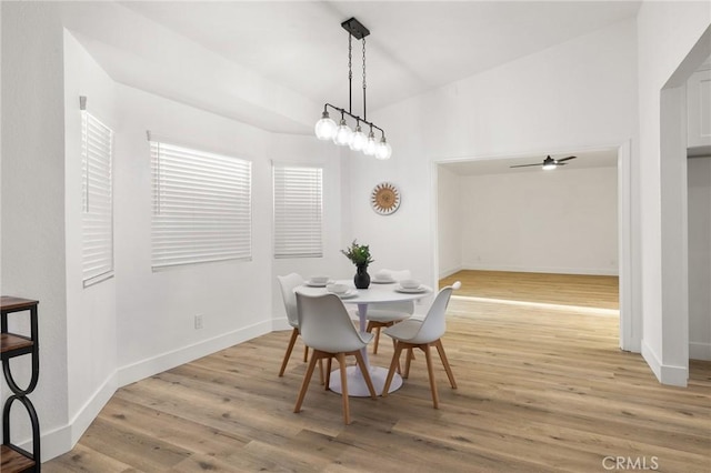 dining room featuring light wood-style floors and baseboards