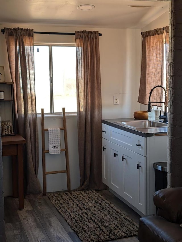 interior space with vanity and hardwood / wood-style floors