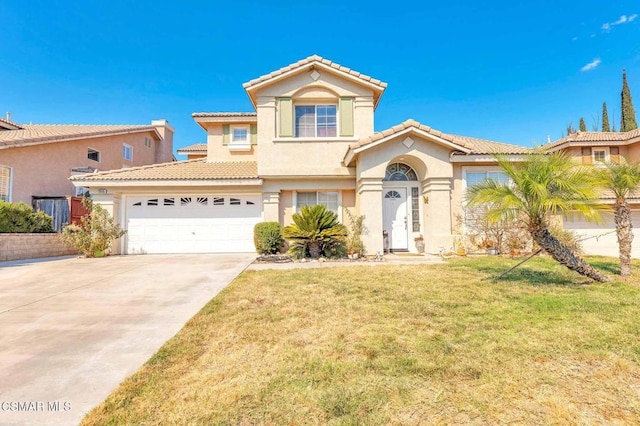 mediterranean / spanish-style home with a front lawn and a garage