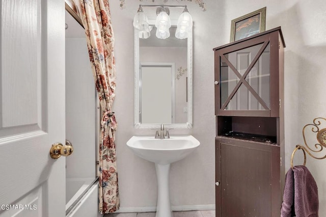 bathroom featuring shower / bath combination with curtain