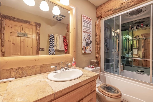 full bathroom with bathtub / shower combination, vanity, and toilet