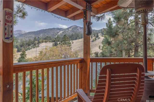 wooden deck with a mountain view