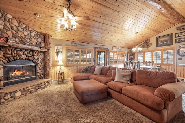 carpeted living room with wood ceiling, wood walls, plenty of natural light, and a stone fireplace