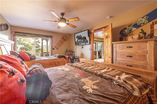 bedroom featuring access to exterior and ceiling fan