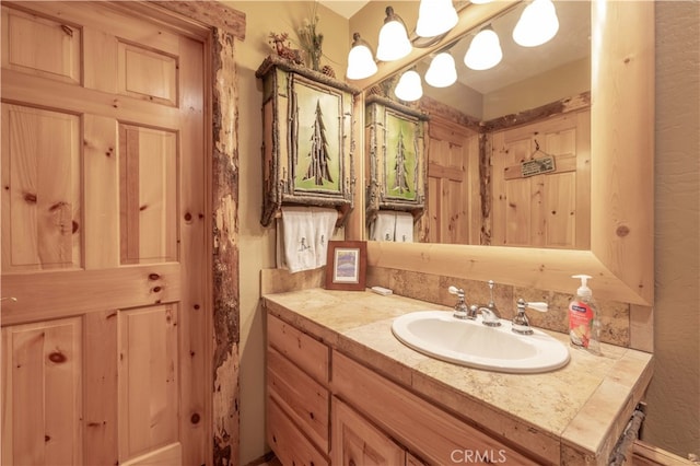 bathroom with vanity and backsplash