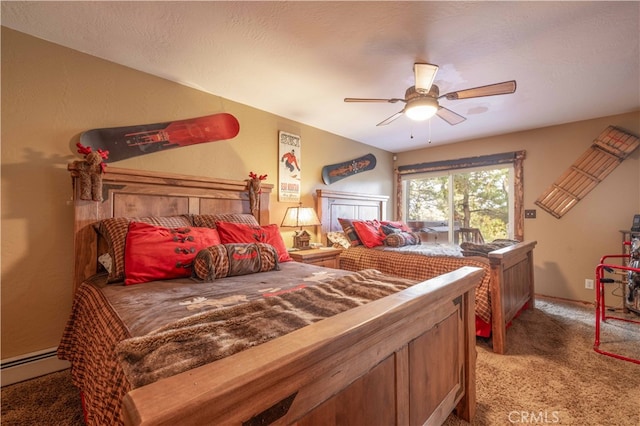 carpeted bedroom featuring ceiling fan, a textured ceiling, and a baseboard radiator