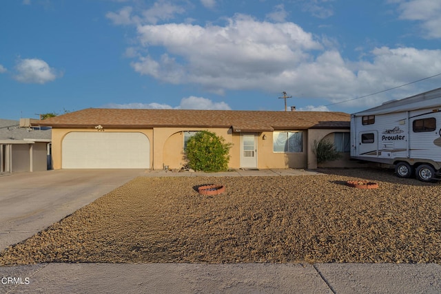 single story home with a garage