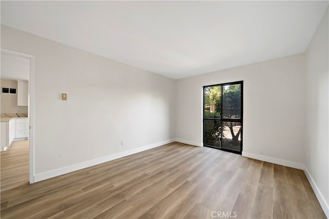 empty room with light wood-type flooring