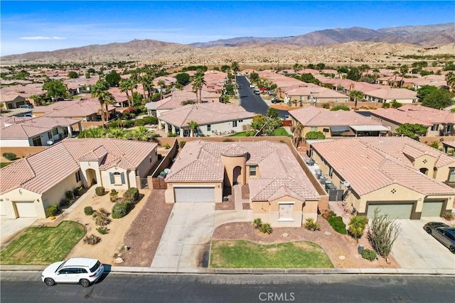 birds eye view of property featuring a mountain view