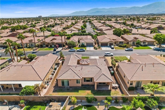 birds eye view of property featuring a mountain view