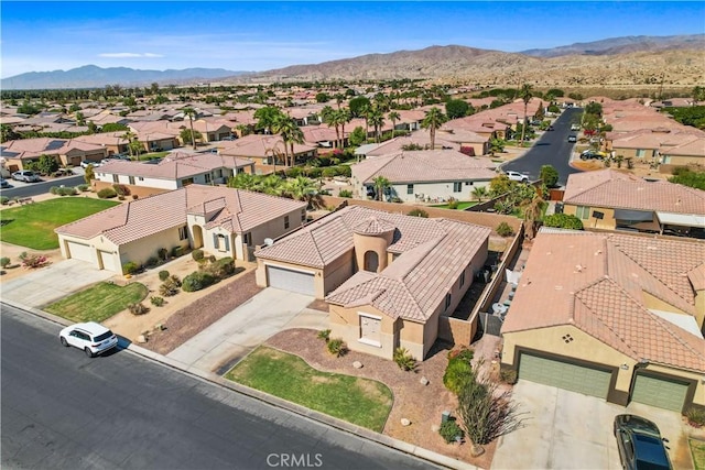 birds eye view of property featuring a mountain view