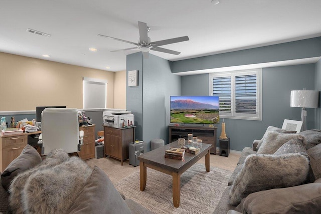 carpeted living room featuring ceiling fan