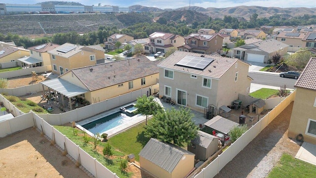 birds eye view of property featuring a mountain view