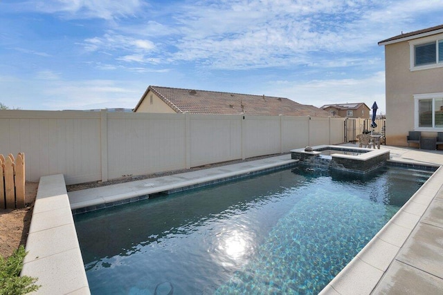 view of pool featuring an in ground hot tub