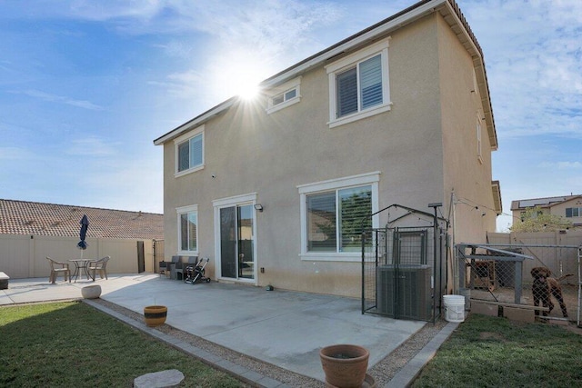 rear view of property featuring a patio area