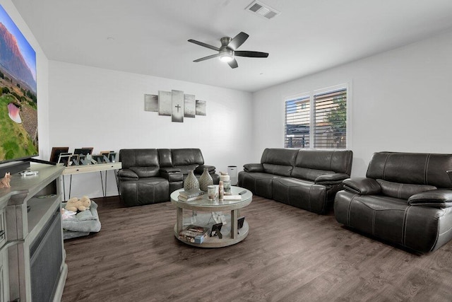 living room with ceiling fan and dark hardwood / wood-style floors