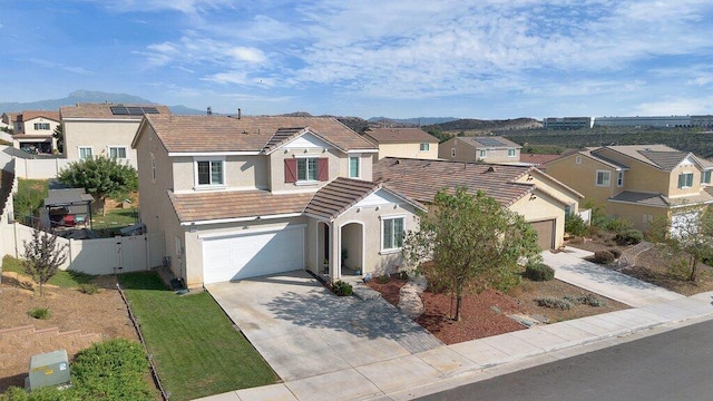 view of front of house featuring a mountain view and a garage