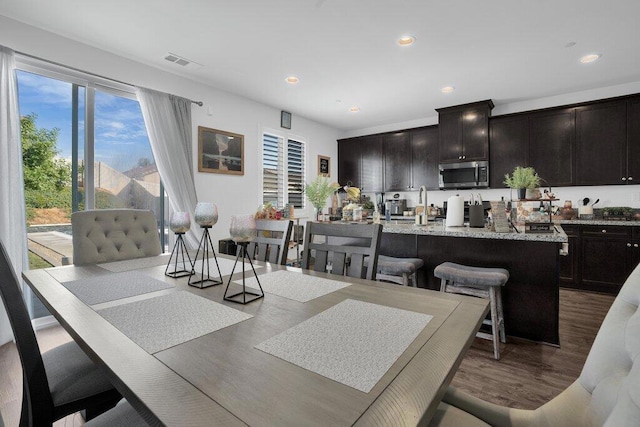 dining area with hardwood / wood-style flooring