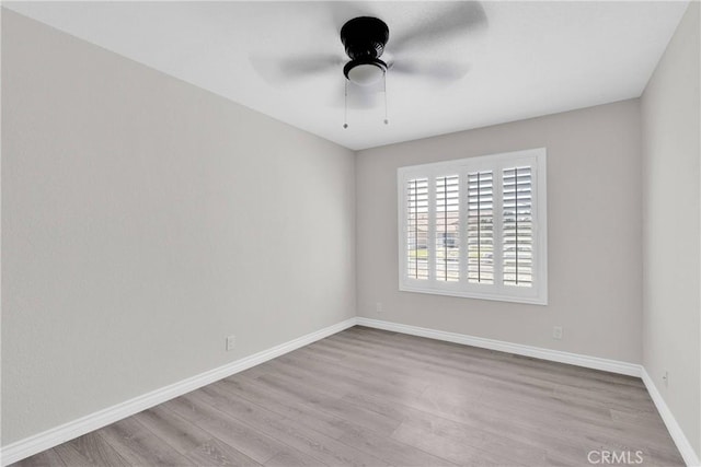 unfurnished room with light wood-type flooring and ceiling fan