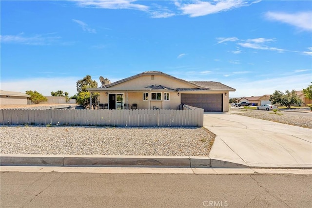 ranch-style house featuring a garage