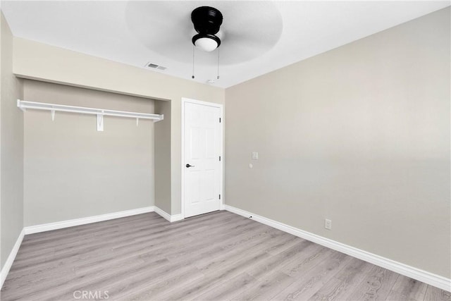 unfurnished bedroom featuring a closet, ceiling fan, and light hardwood / wood-style floors