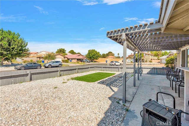 view of yard with a pergola and a patio area