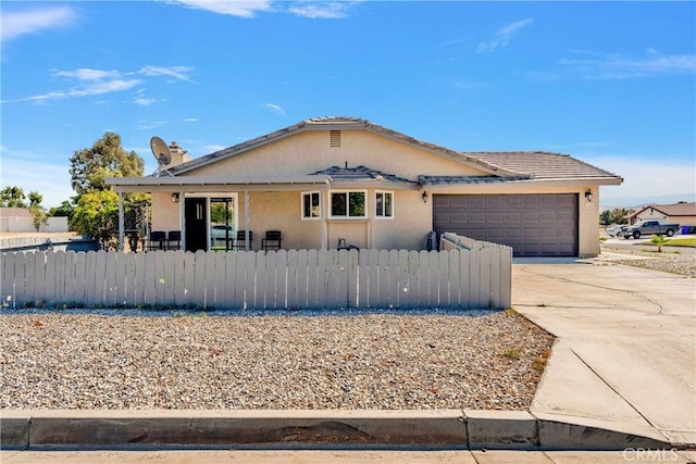 ranch-style house featuring a garage