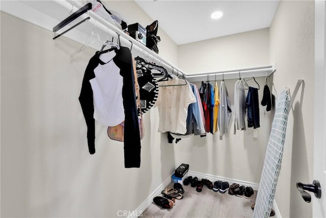 spacious closet featuring hardwood / wood-style flooring