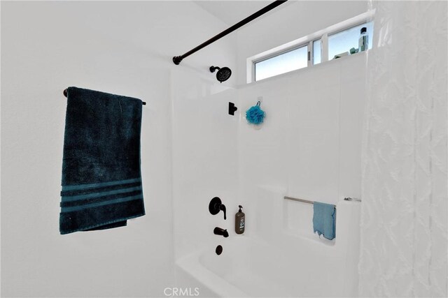 bathroom featuring  shower combination