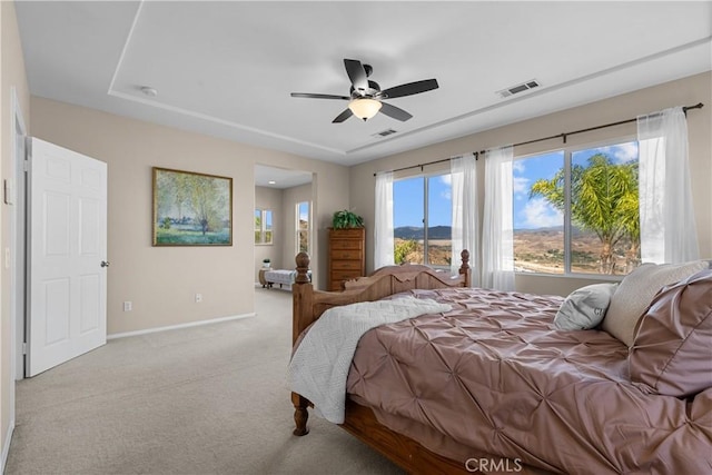 bedroom with ceiling fan and light colored carpet