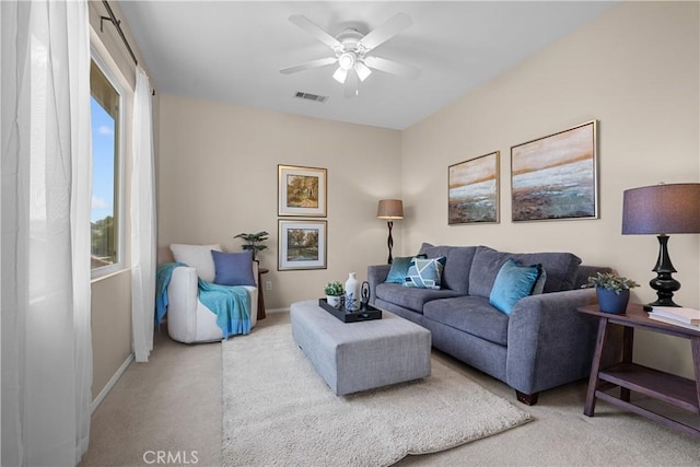 living room with carpet flooring and ceiling fan