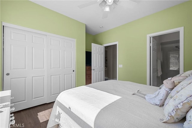 bedroom with dark hardwood / wood-style flooring, a closet, and ceiling fan