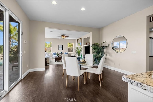 dining space featuring dark hardwood / wood-style floors, plenty of natural light, and ceiling fan