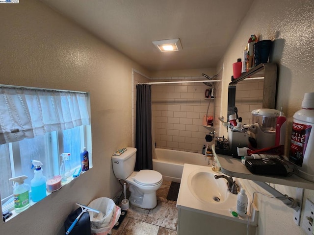 full bathroom with shower / bathtub combination with curtain, vanity, and toilet