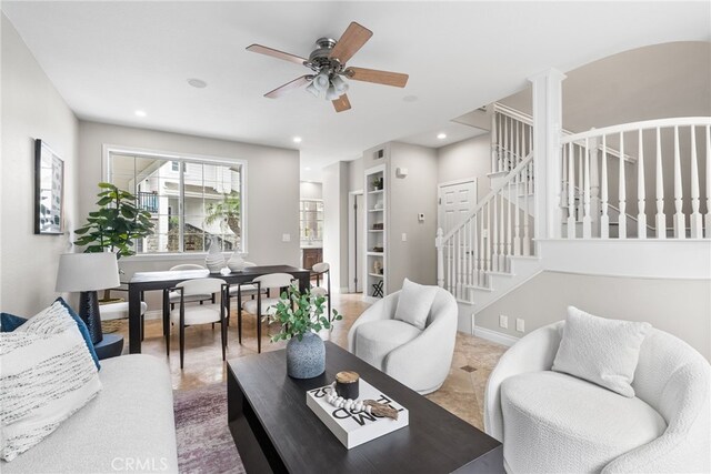 living room featuring ceiling fan